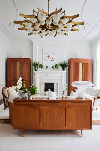 An imposing chandelier by Gio Ponti set the midcentury tone of the room.