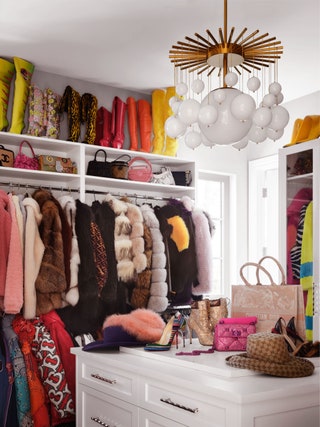 closet with colorful coats and boots