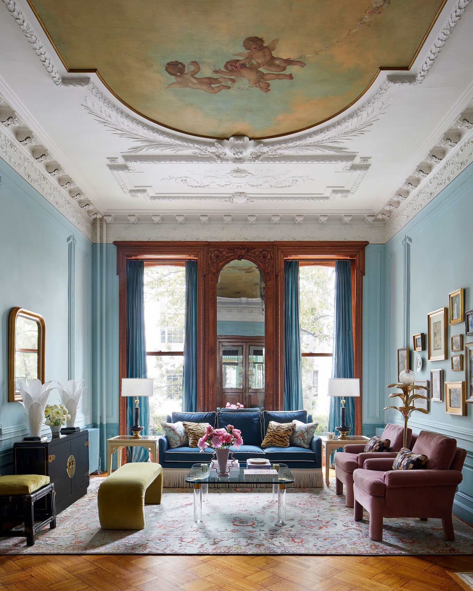 Brownstone parlor with intricate ceiling molding and antique frescoe