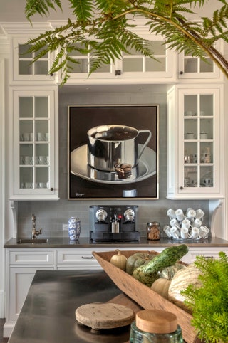 Purple Cherry Architects crafted this coffee bar complete with custom cabinetry designed around a specific piece of...