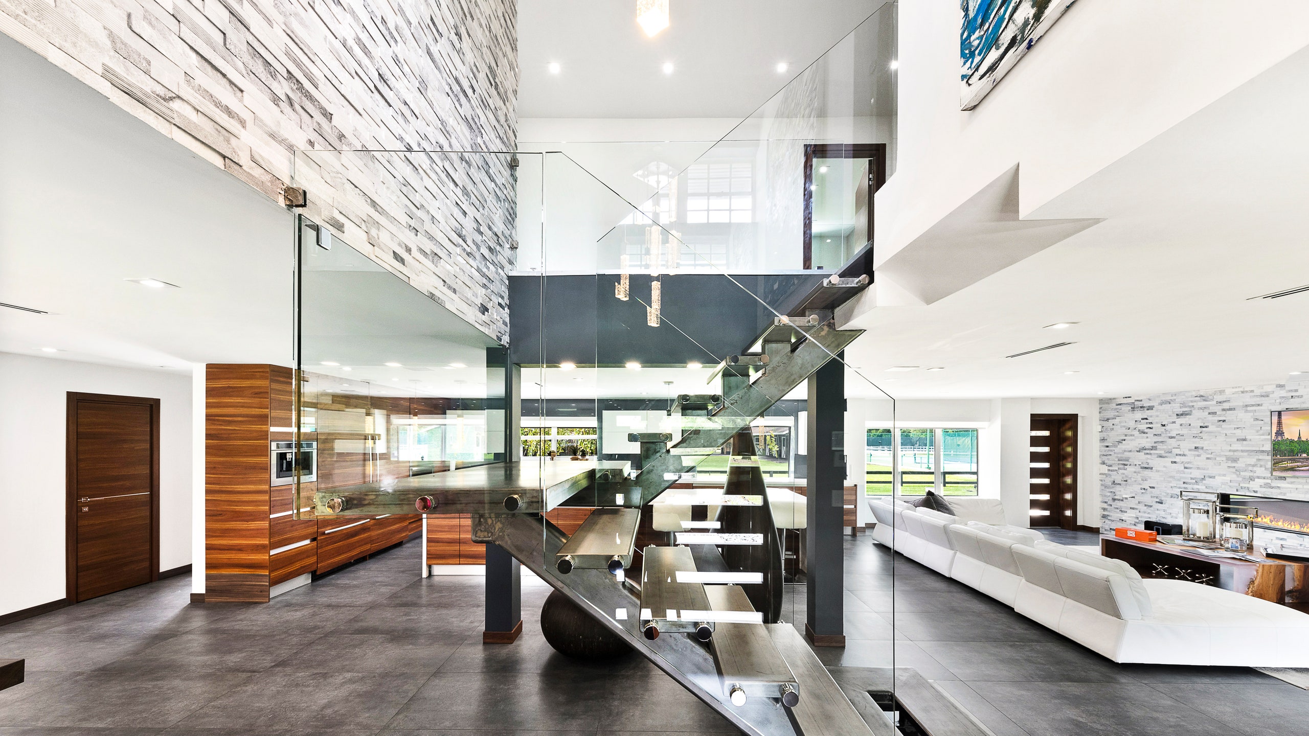 Modern glassy whitewalled interior glass staircase