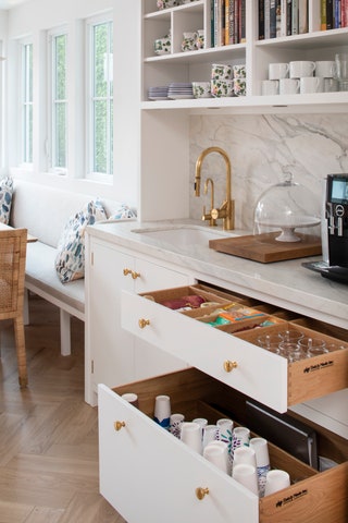 Rows of drawers below the counter in this elegant coffee nook make it easy to find the coffee supplies coffee mugs and...